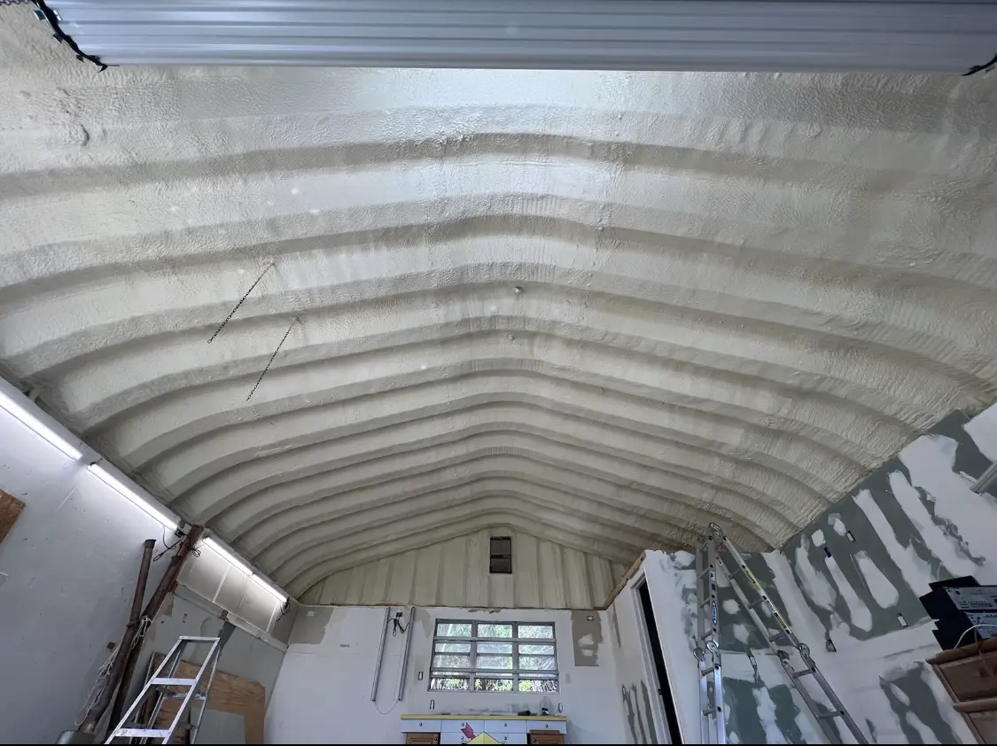 Spray polyurethane foam applied to the underside of a metal roof deck in Gloucester Point